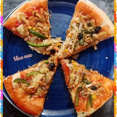 A picture of Chicken spicy Tikka Pizza.