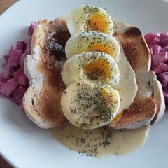 A picture of Sig's Eggs in Mustard Saffron Sauce with Beetroot Salad.