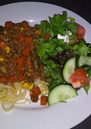 A picture of Pasta with Green Salad.