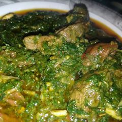 A picture of Sarsoo ka saag with chicken.