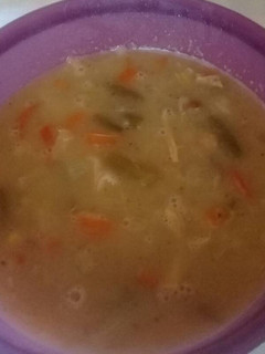 A picture of Chicken soup with beans and veggies.
