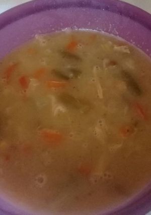 A picture of Chicken soup with beans and veggies.
