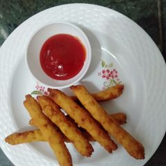 A picture of Poha flattened rice potato fingers.