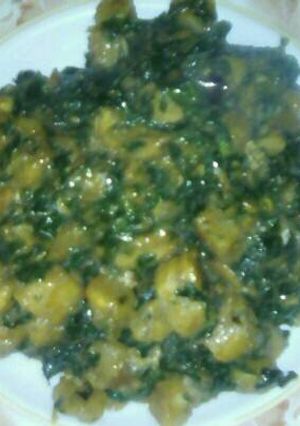 A picture of Unripe plantain and vegetables porridge.