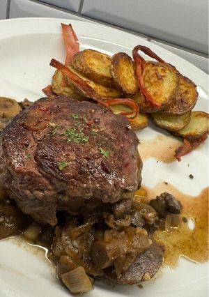 A picture of Beef Tenderloin with Mushrooms.