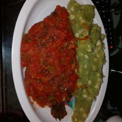 A picture of Fried fish served with mukimo.