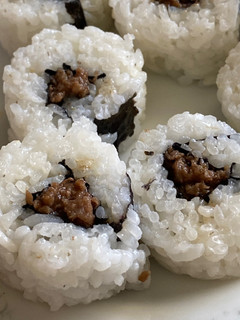A picture of Beef sushi.