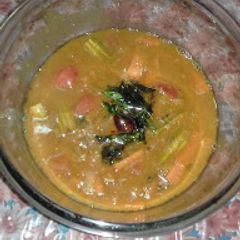 A picture of Masoor Dal Sambhar with Pressure Cooker.