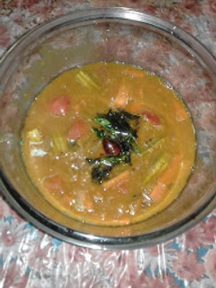 A picture of Masoor Dal Sambhar with Pressure Cooker.