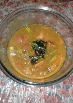 A picture of Masoor Dal Sambhar with Pressure Cooker.