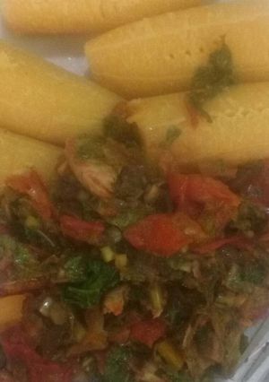 A picture of Boiled plantain and veggie sauce.