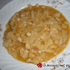 A picture of Beans with pickled cabbage.