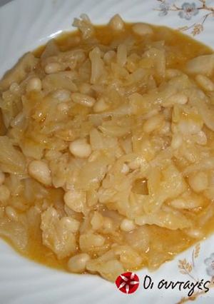 A picture of Beans with pickled cabbage.