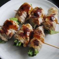 A picture of Pork Belly Rolls on Skewers.