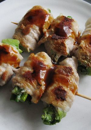 A picture of Pork Belly Rolls on Skewers.