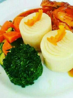 A picture of Mashed potatoes,stewed chicken and Sisibo with buttered Veges.