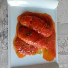 Una foto de Merluza con tomate al aceite de albahaca