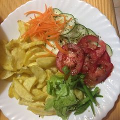 A picture of Rosemary garlic potato wedges with salad.
