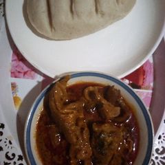 A picture of Banga soup and pounded yam.