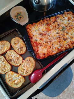 A picture of Spinach Rotini Bake with Meat Sauce & Homemade Garlic Toast.