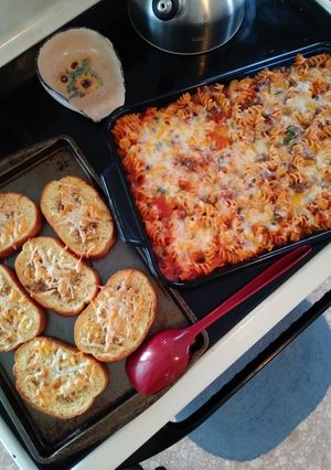A picture of Spinach Rotini Bake with Meat Sauce & Homemade Garlic Toast.