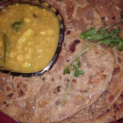 A picture of Sattu paratha with chana dal.