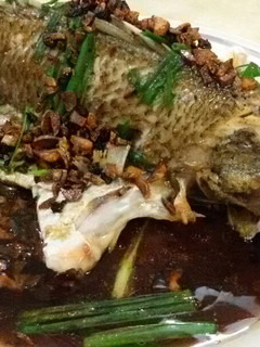 A picture of Steam Fish in Supreme Soy Sauce topped with Salted Black Daze.