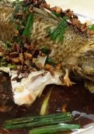 A picture of Steam Fish in Supreme Soy Sauce topped with Salted Black Daze.