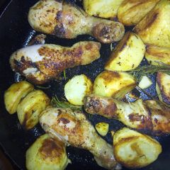 A picture of Cast iron skillet chicken with potatoes.