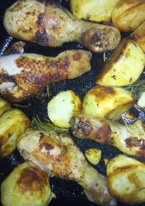A picture of Cast iron skillet chicken with potatoes.