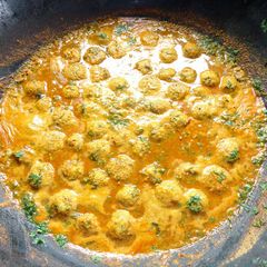 A picture of Paruppu Urundai Kuzhambu / South Indian Toor dal Kofta Curry.