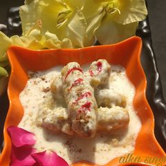Stuffed Sweet potato rolls in milk rabri A picture of Stuffed Sweet potato rolls in milk rabri.