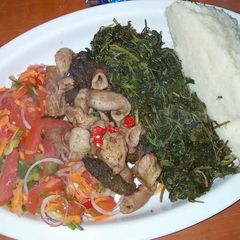 A picture of Fried Matumbo, Kachumbari, boiled dodo and Ugali.