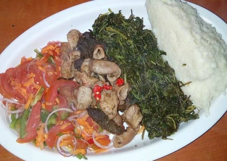 Fried Matumbo, Kachumbari, boiled dodo and Ugali