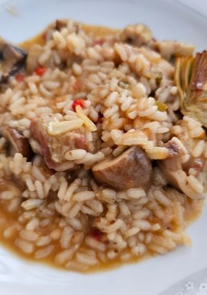 Una foto de Arroz meloso de lagarto y setas