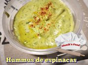 Una foto de garbanzos con espinacas cominos