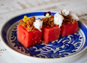 A picture of Pla Hang Tang Mo. Watermelon with sweet and salty salmon flakes.