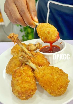 A picture of Crispy Chicken Drumsticks Stuffed With Mashed Potatoes & Cheese.