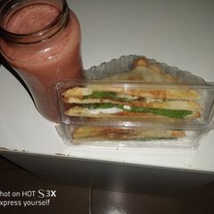 A picture of Bread sandwich & Mango banana smoothie.