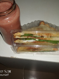 A picture of Bread sandwich & Mango banana smoothie.