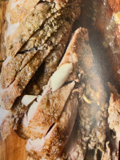A picture of Cumin-spiced pork tenderloin with root vegetables.