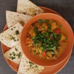A picture of Potato, mushroom and coconut curry pot & coriander tortilla.