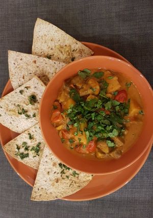 A picture of Potato, mushroom and coconut curry pot & coriander tortilla.