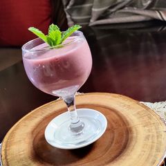 A picture of Pomegranate, Orange Lassi.