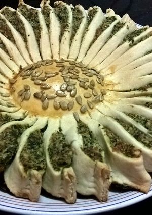Una foto de Tarta sol con espinaca, ricota y parmesano