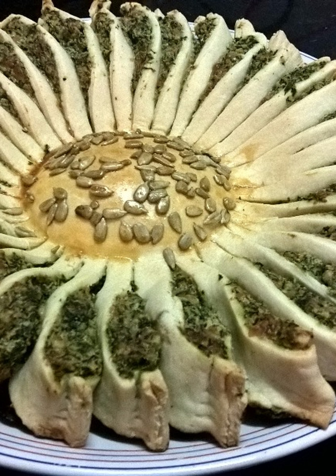 Una foto de Tarta sol con espinaca, ricota y parmesano