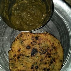 A picture of Sarso ka saag with makai methi roti.