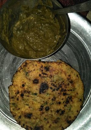 A picture of Sarso ka saag with makai methi roti.