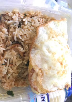 A picture of Concoction Rice and fried egg.