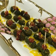 A picture of Golden Cheesy Palak Nuts 🥜.